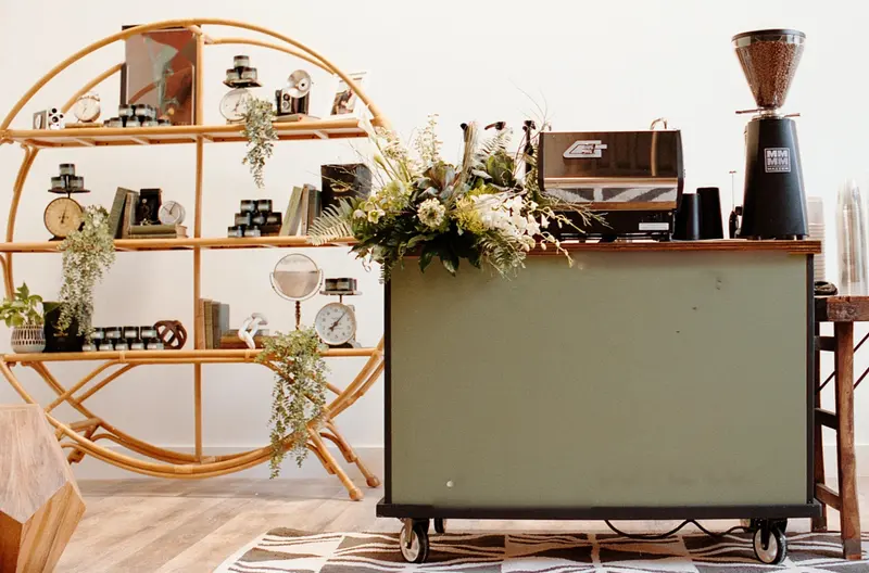 The hand-built espresso cart dressed with seasonal florals, shot on film